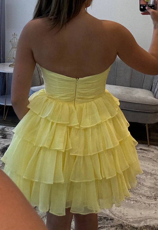 Pale yellow chiffon strapless ruched zipper back tiered short homecoming dress back view
