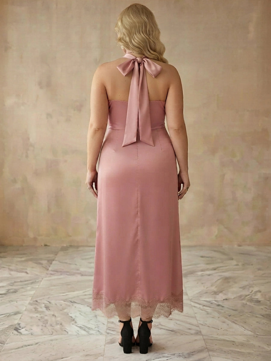Dusty rose plus size midi dress back view, halter tie bow at neck, open back, center back seam and lace trim hem