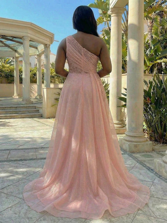 Plus size pink evening dress with one-shoulder neckline, center back zipper and flowing tulle skirt
