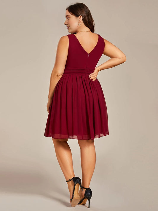 Plus size burgundy chiffon homecoming dress featuring V-back and center zipper