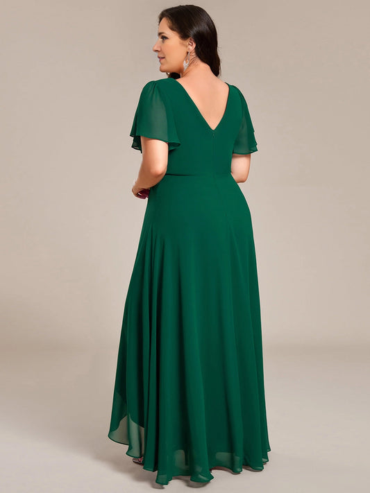 Emerald green mother of the bride dress with V-back and flowing maxi skirt