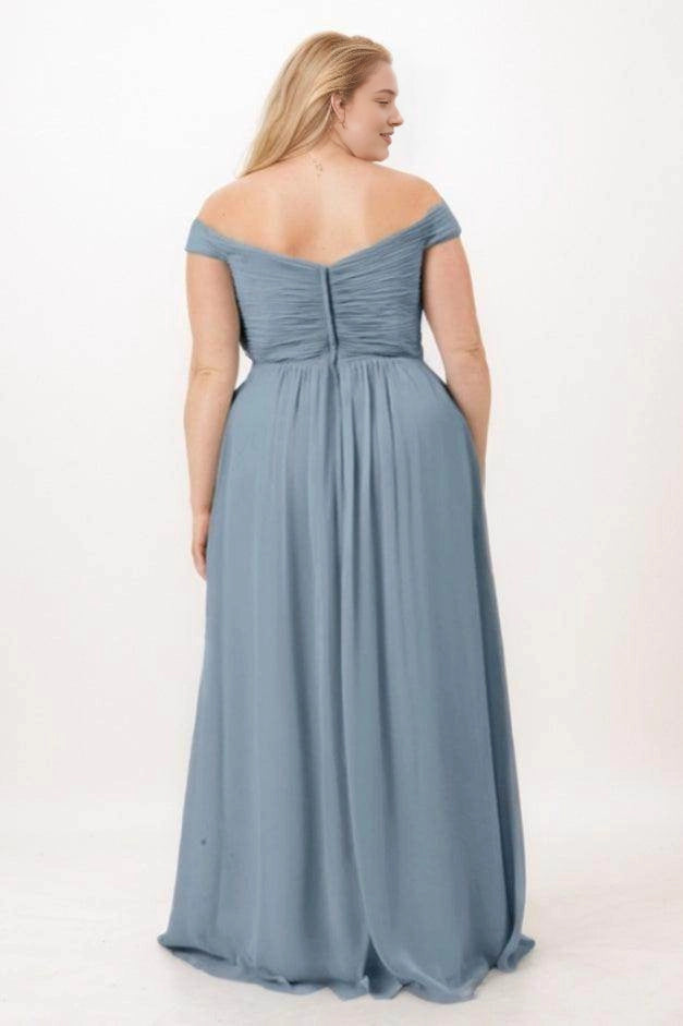 Back view of Roselledress dusty blue bridesmaid dress with draped sleeves, a shallow V back, gathered bodice and center zipper.