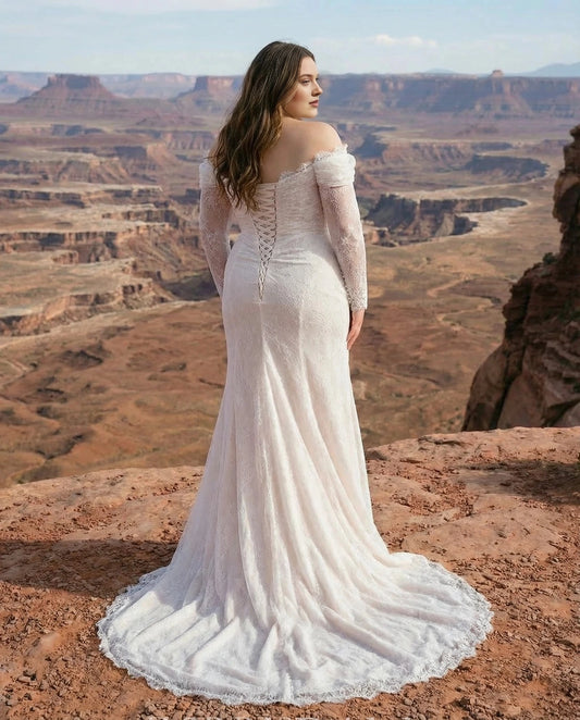 Ivory plus size wedding dress with lace-up corset back, fitted silhouette, off-shoulder lace sleeves and flowing sweep train
