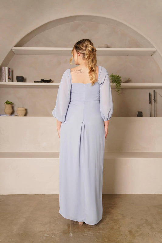 Back view of plus size dusty blue bridesmaid dress featuring square back, center zipper, balloon sleeves and floor-length skirt with center back opening by roselledress.