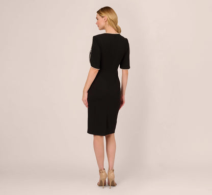 roselledress closed back black crepe sheath dress pearl edged cape sleeve back slit mother of the bride formal wear back view