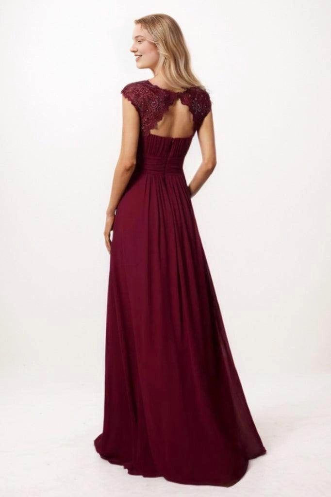 Back view of a Roselledress burgundy bridesmaid dress with scalloped floral lace framing a keyhole opening, a ruched waist and flowing long skirt.