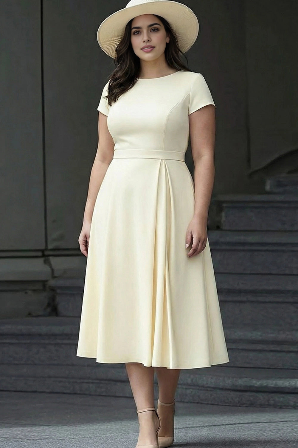 Ivory plus size A-line mother of the bride midi dress with round neckline, short sleeves and pleated skirt.