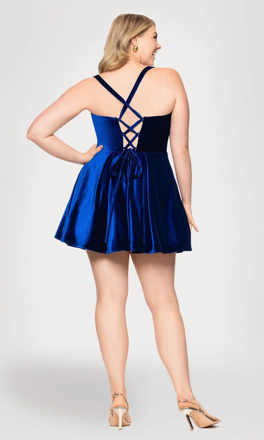 Plus size royal blue velvet homecoming dress featuring crisscross lace-up open back