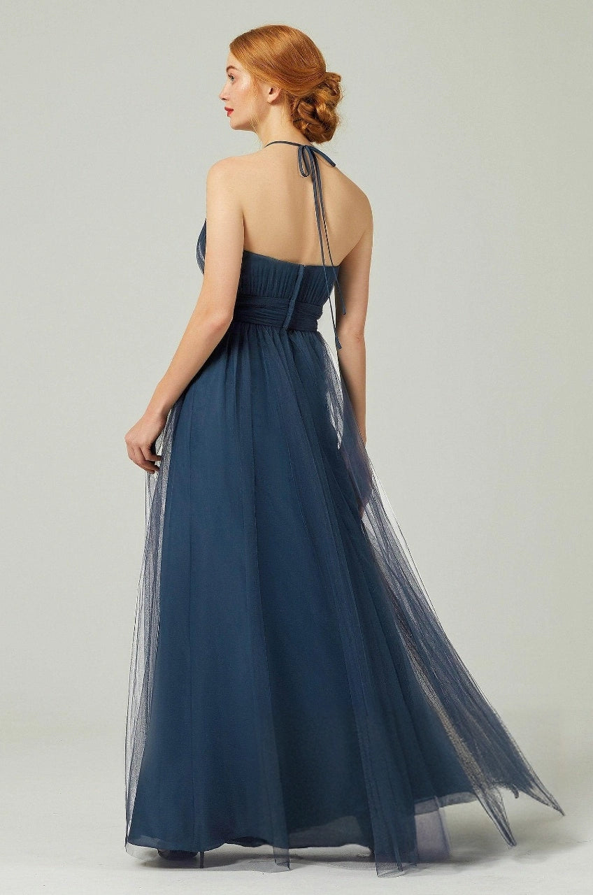 Navy tulle bridesmaid dress with a halter neck tie, open upper back, pleated bodice and center-back zipper, back view.