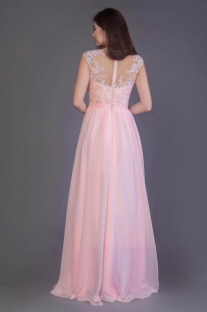 Pink bridesmaid dress with floral lace over a sheer illusion back, a fitted lower bodice and gathered floor-length skirt, back view.