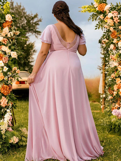 Back view of roselledress dusty pink beaded illusion open back plus size chiffon maxi formal bridesmaid gown