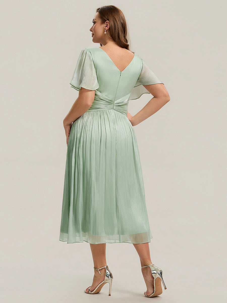 Roselle Dress plus size sage chiffon wedding guest gown, back v‑neck twisted waist detail, flowy midi dress back view