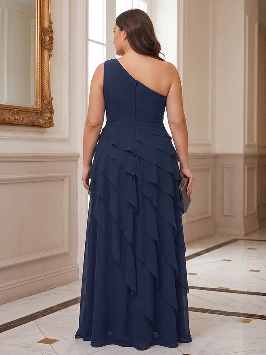 Model wearing roselledress navy chiffon wedding guest dress one‑shoulder invisible zip back cascading ruffle rear view