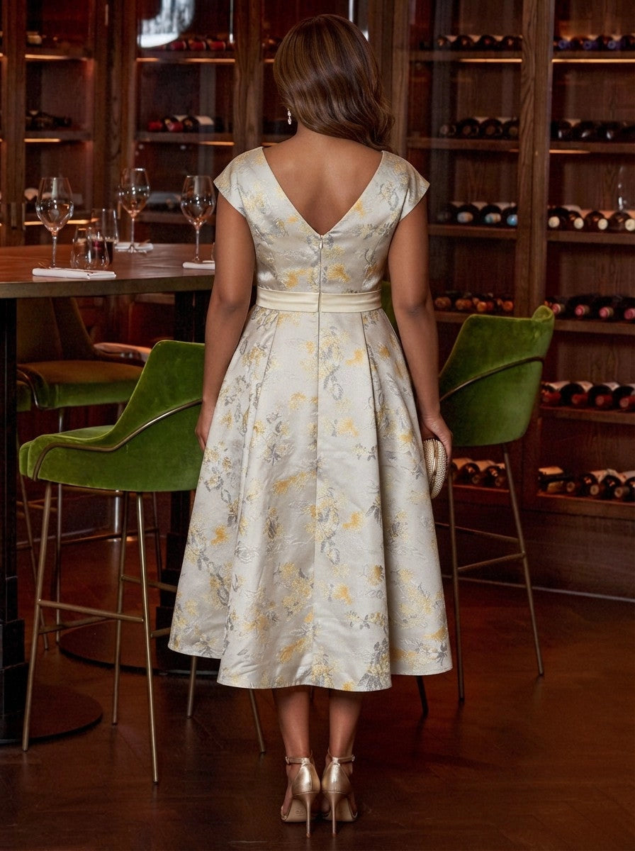 Champagne gold brocade plus size midi dress back view, deep V-back, center back zipper, cap sleeves and full pleated A-line skirt
