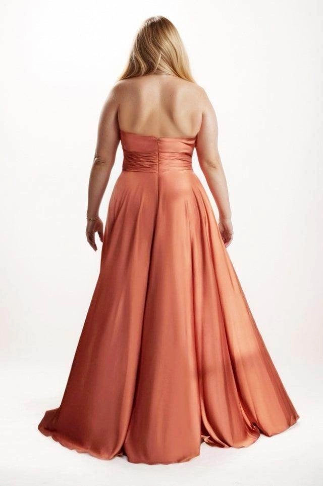 Terracotta satin bridesmaid dress with a low straight back, ruched waistband, center-back zipper and flowing floor-length skirt, back view.
