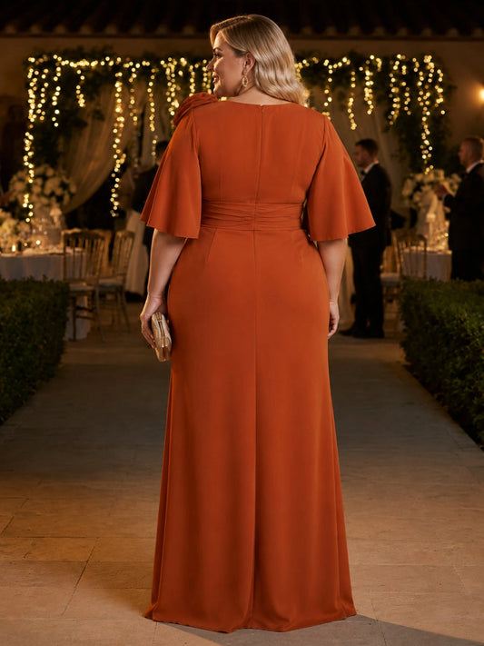 Burnt orange plus size evening gown back view, round neck, center back zipper, flutter sleeves and trumpet floor length skirt
