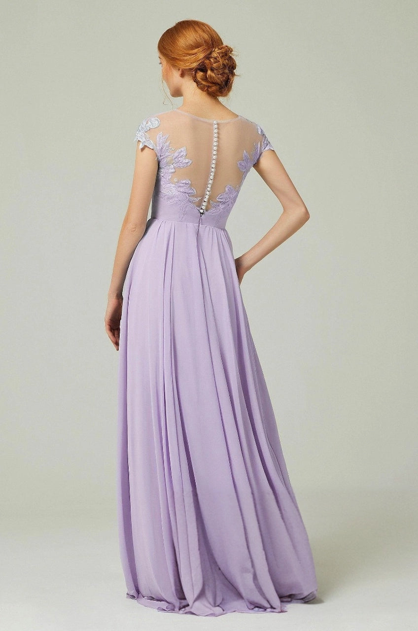 Roselledress lavender bridesmaid dress with a sheer floral lace back, central button row and flowing long skirt.