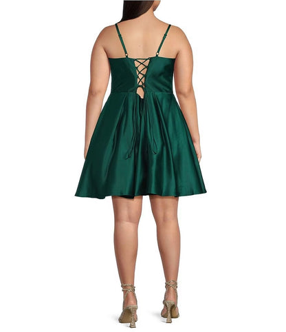Plus size emerald green satin homecoming dress featuring crisscross lace-up back and keyhole detail

