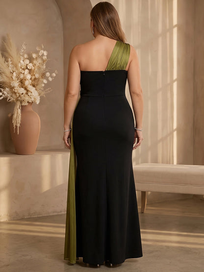 Black plus size formal dress back view, one shoulder strap, center back zipper, olive green draped sash and mermaid floor length skirt
