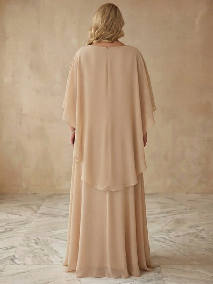 Champagne plus size formal gown back view, round neck, center back zipper, flowing capelet overlay and long chiffon skirt
