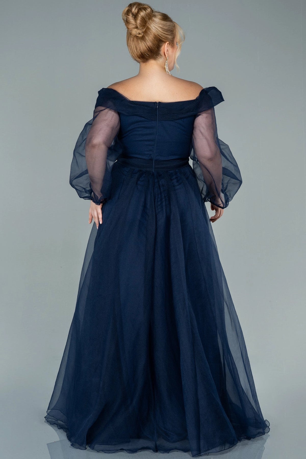 Back view of a roselledress plus size navy blue off shoulder evening dress with zipper back and layered skirt