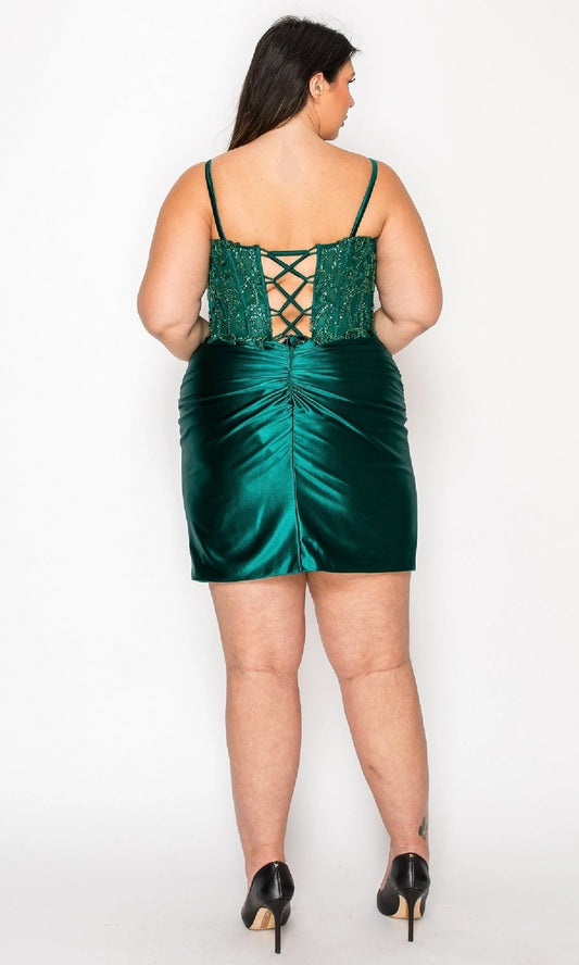 Plus size emerald green homecoming dress featuring crisscross lace-up corset back and ruched skirt
