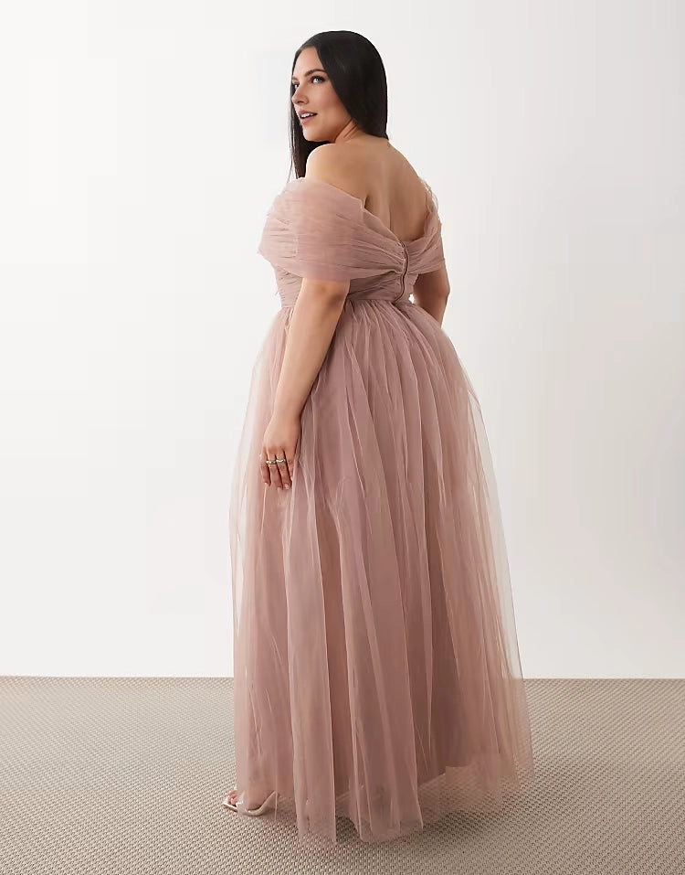 Back view of roselledress mauve tulle off‑shoulder zipper‑back plus size floor‑length formal wedding guest gown