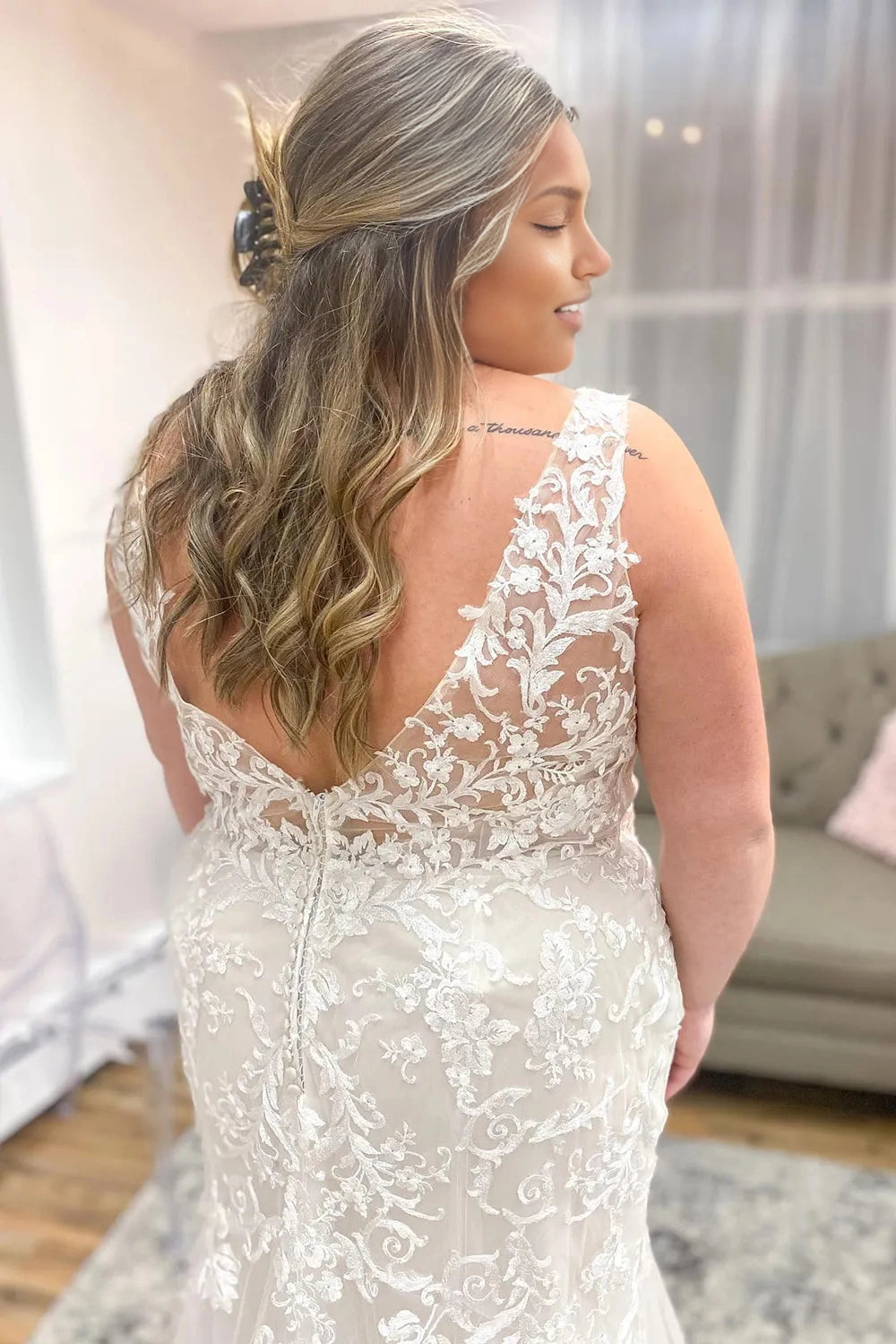 Curvy bride wearing Roselledress illusion back plus‑size floral lace mermaid wedding dress