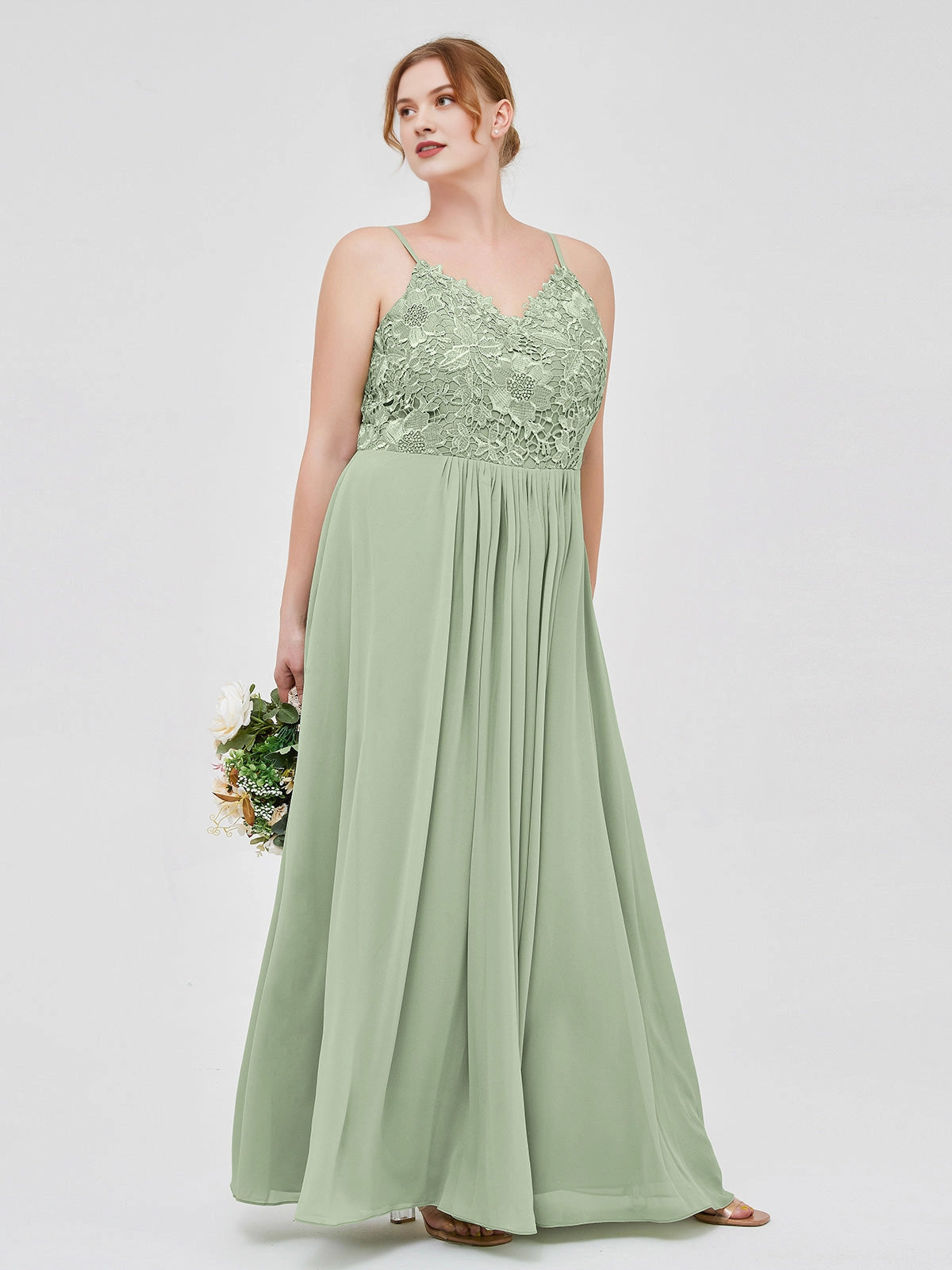 Roselledress sage green plus size bridesmaid dress with a floral lace V-neck bodice, slender straps, side pockets and a floor-length chiffon skirt.