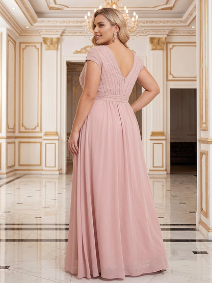Model wearing roselledress blush plus size chiffon formal dress deep v back invisible zipper beaded bodice rear view