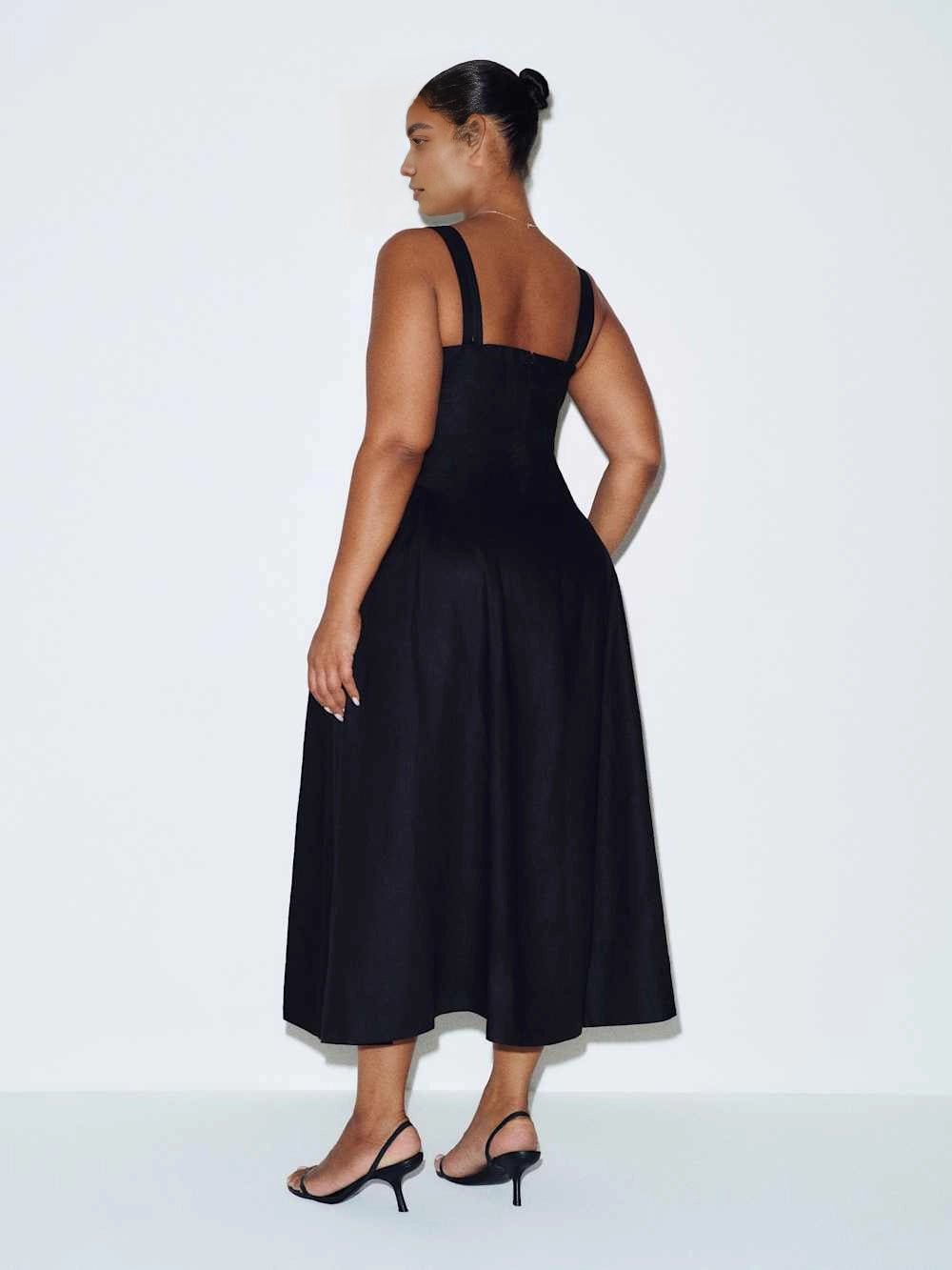 roselledress black structured plus‑size midi formal dress wide shoulder straps simple back a‑line flared skirt wedding guest dress back view