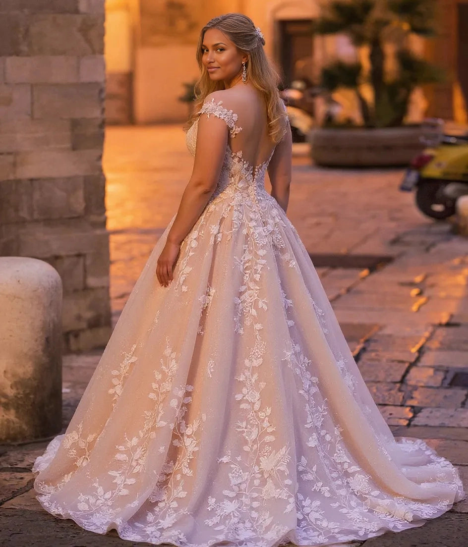 Curvy bride wearing Roselledress illusion back plus‑size lace wedding dress shimmer tulle chapel train