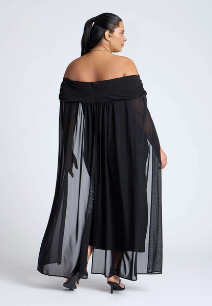 Black plus size off shoulder low back flowing sheer cape long wedding guest dress back view