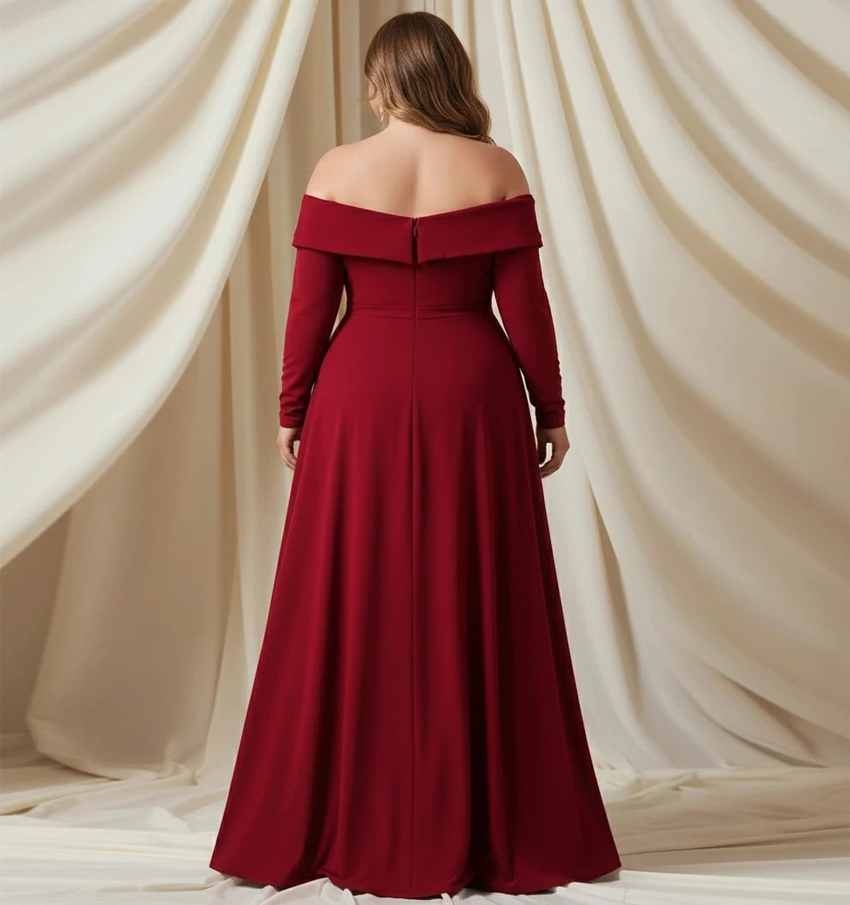 Back view of a burgundy plus size prom dress featuring an off-the-shoulder back, long sleeves and center-back zipper.