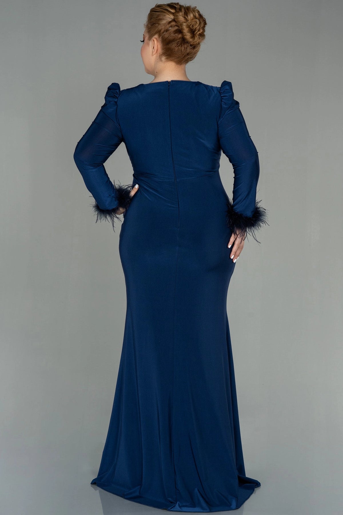 Back view of a roselledress plus size navy blue long sleeve evening dress with zipper back and mermaid hem