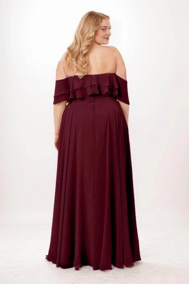 Burgundy bridesmaid dress with a low straight back, layered ruffle sleeves, center-back zipper and gathered floor-length skirt, back view.