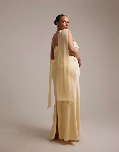 Back view of roselledress butter yellow open‑back cape detail plus size slit floor‑length formal gown