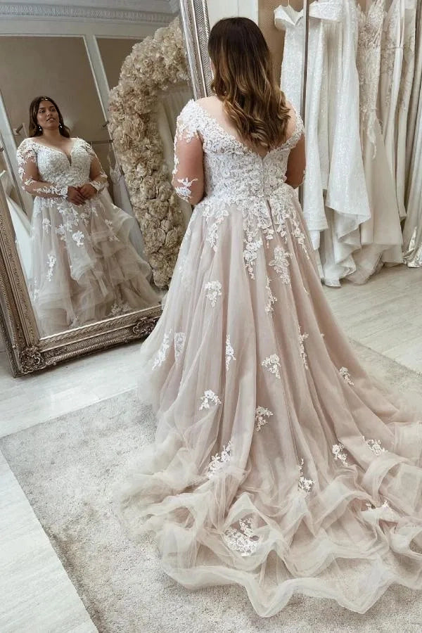Curvy bride wearing Roselledress v‑back plus‑size lace wedding dress tiered tulle chapel train