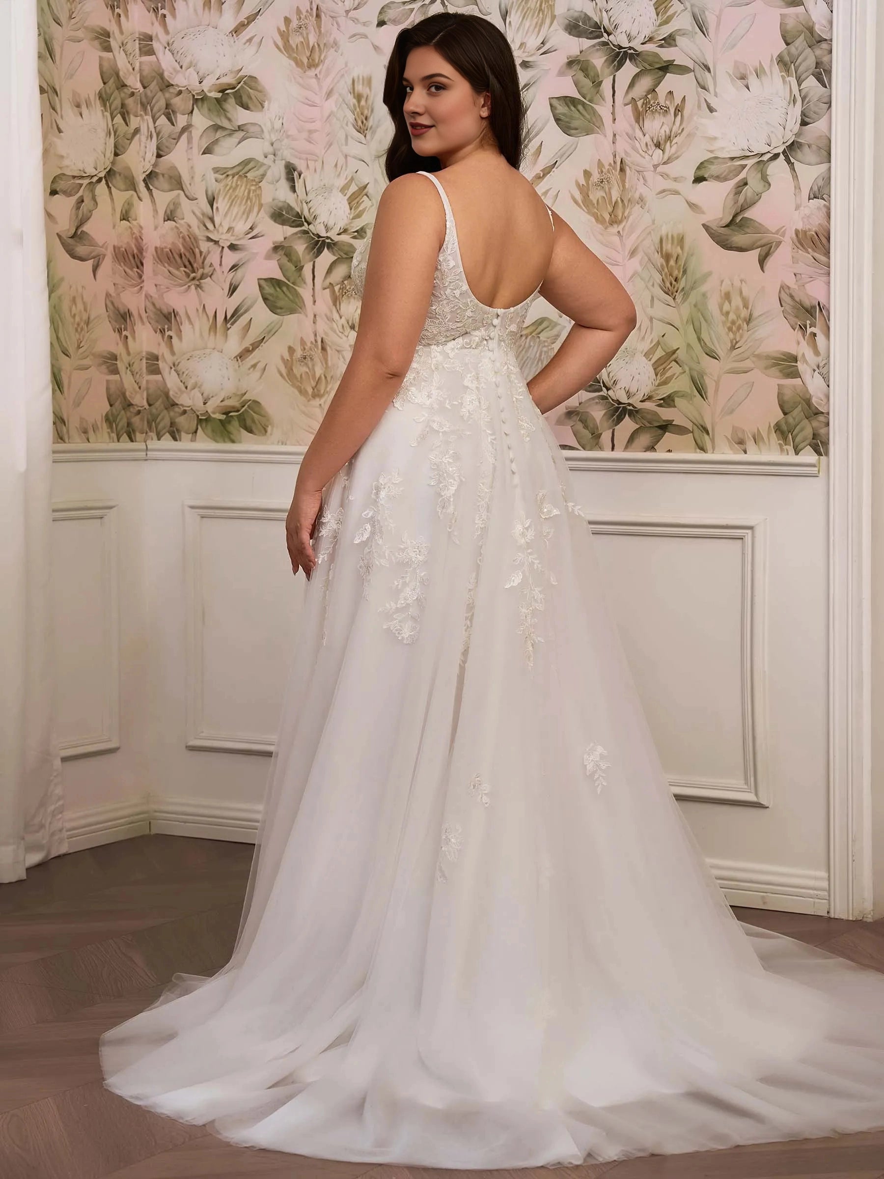 Curvy bride wearing Roselledress u‑back plus‑size wedding dress covered button back view