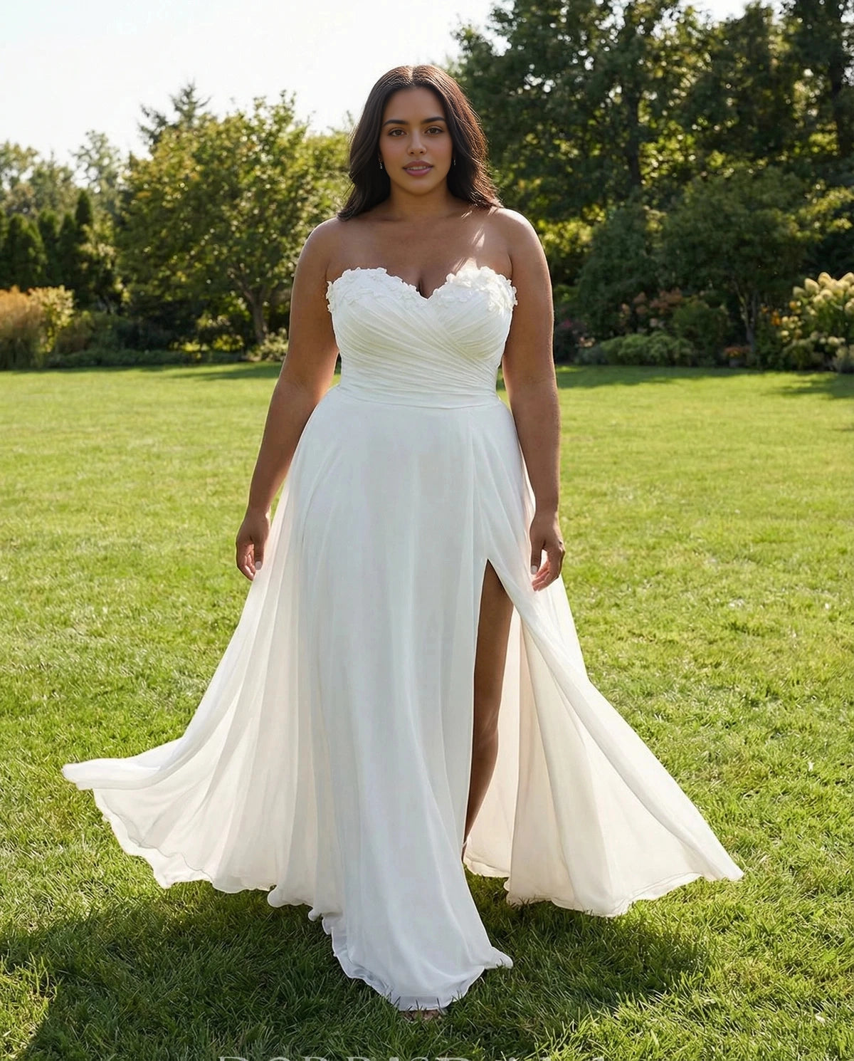 Ivory plus size A-line wedding dress with a sweetheart strapless neckline, floral embellishments, high slit and flowing skirt.