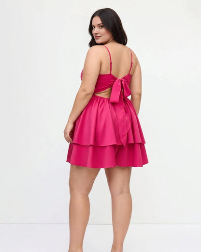 Plus size hot pink homecoming dress featuring bow tie back, cutout and tiered skirt
