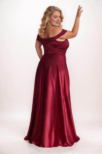 Back view of a Roselledress burgundy satin bridesmaid dress with a folded off-shoulder band, low back, gathered bodice and flowing long skirt.