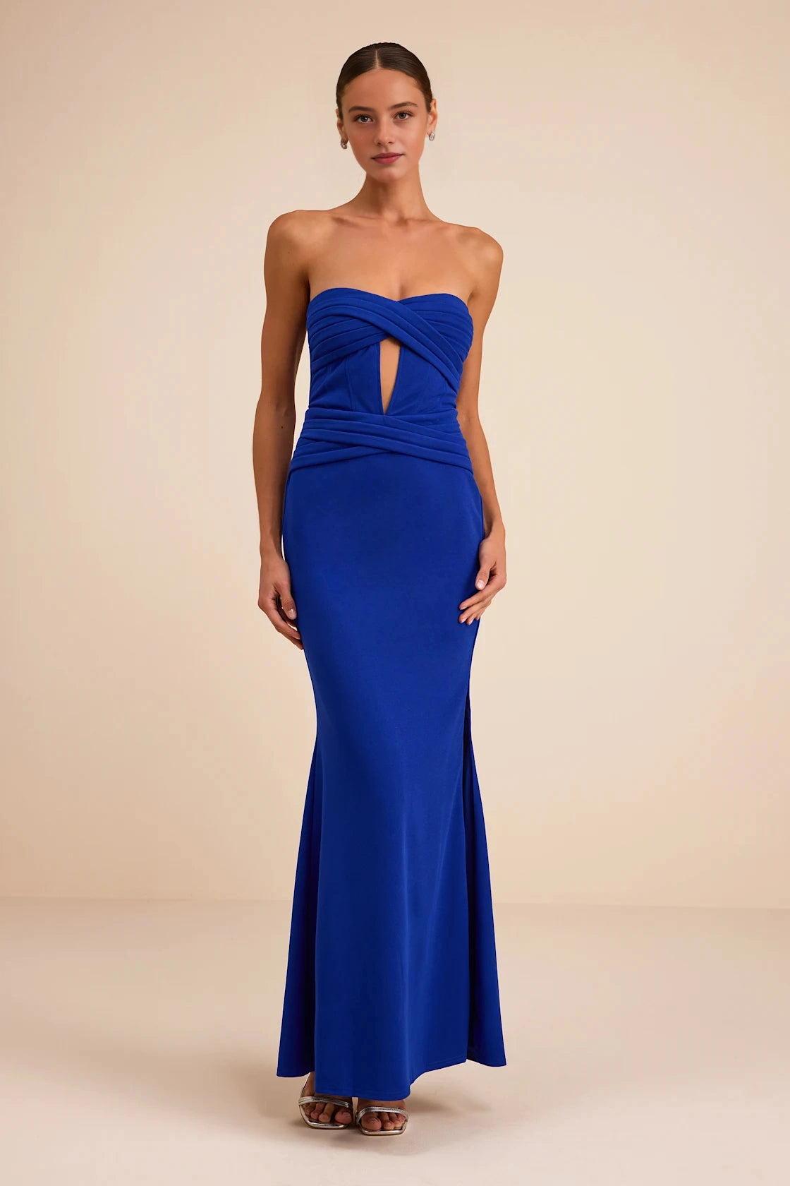 roselledress vibrant royal blue matte stretch knit strapless twisted wrap bust keyhole cutout waist double ruched high thigh slit long prom evening gown neutral beige studio front full shot
