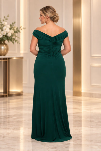 Back view of an emerald green wedding guest dress with folded off-shoulder sleeves, a shallow V-back and gathered center-back ruching.