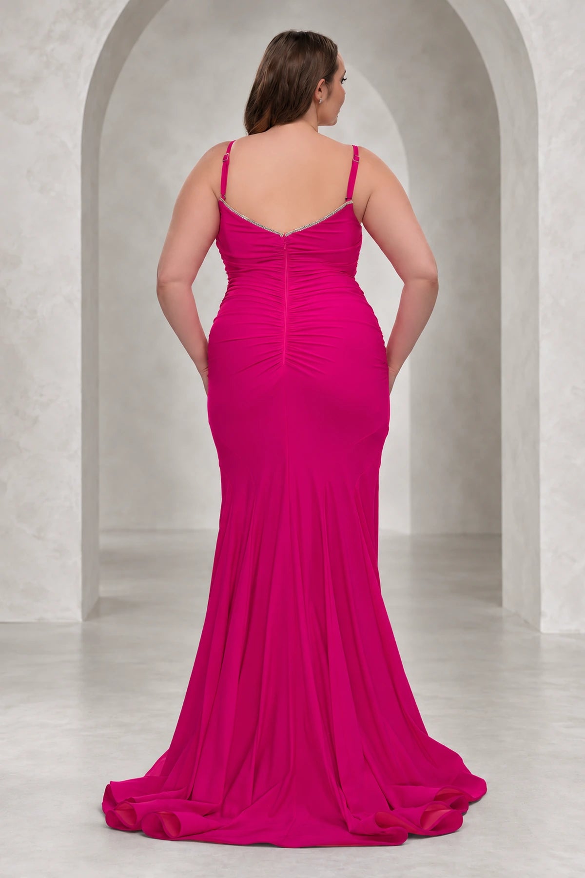 Back view of Roselledress hot pink mermaid prom dress with adjustable straps, embellished V-back, ruching and center zipper.