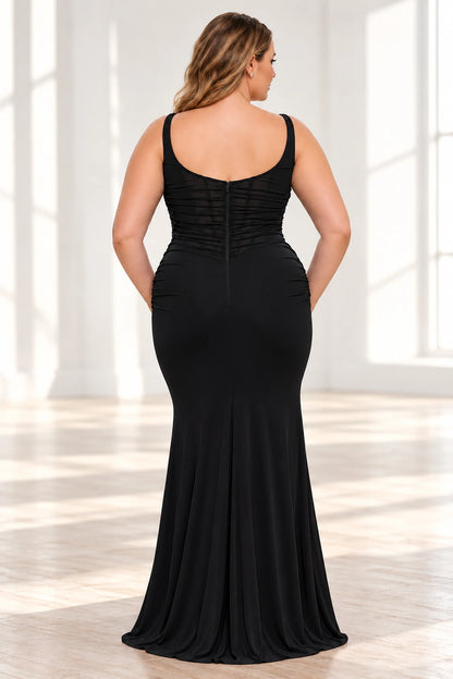 Back view of a black sheath evening dress featuring a low scoop back, ruched sheer mesh bodice and center-back zipper.