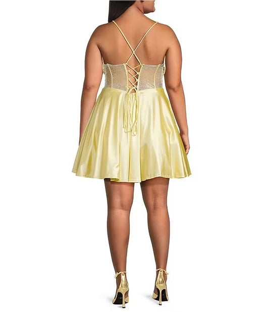 Plus size yellow satin homecoming dress featuring crisscross lace-up rhinestone corset back