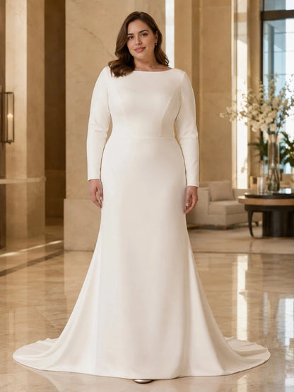 Ivory plus size mermaid wedding dress with bateau neckline, long sleeves and a smooth fitted silhouette.