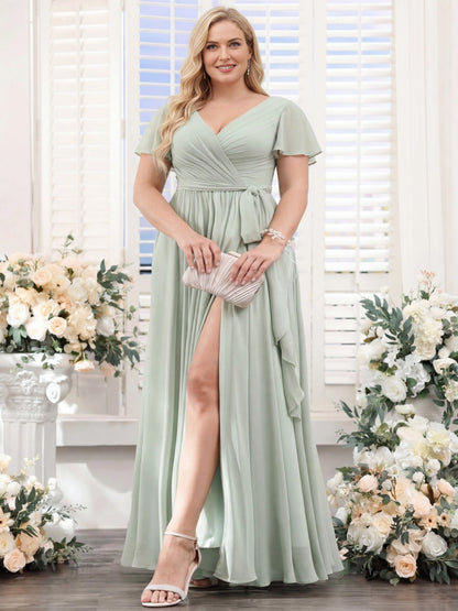 Roselledress sage green chiffon plus size bridesmaid dress front view, flutter sleeve v-neck wrap waist gown with high leg slit