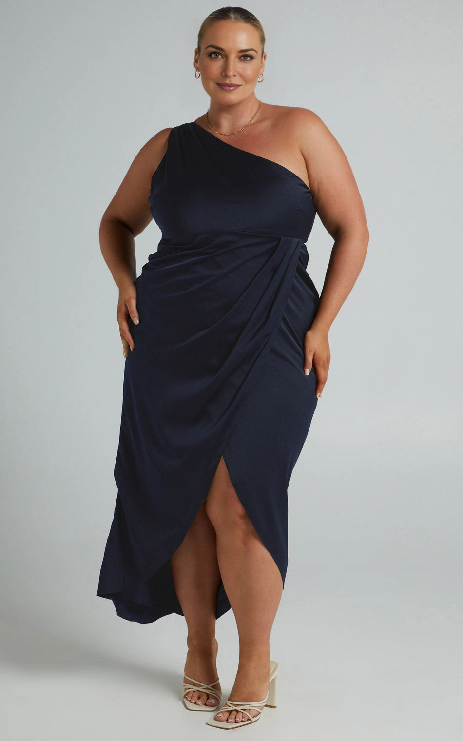 Roselledress navy satin plus size bridesmaid midi dress front view, one shoulder ruched wrap skirt with front thigh split